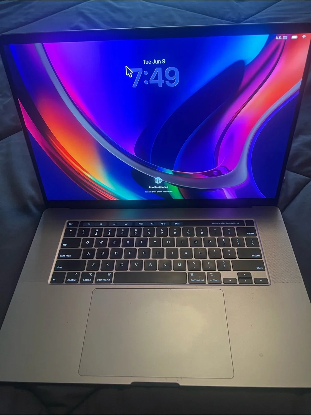 Apple Space Gray MacBook with Brown Leather Sleeve